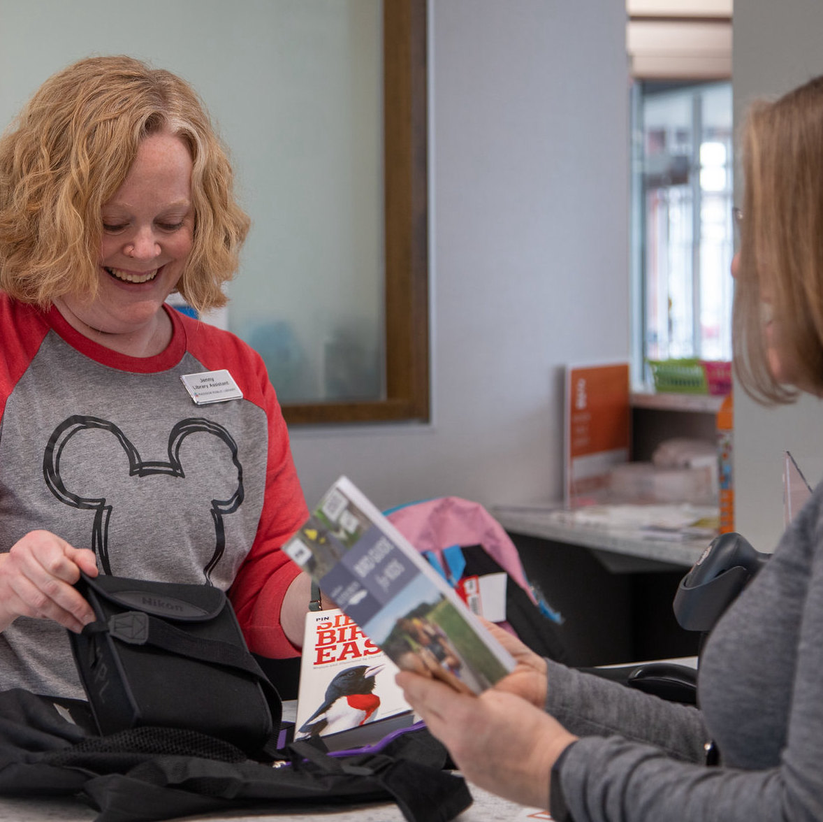 Birding backpack Librarian checking out a birding backpack