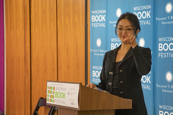 Adrienne Chung speaking at 2023 Wisconsin Book Festival Fall Celebration