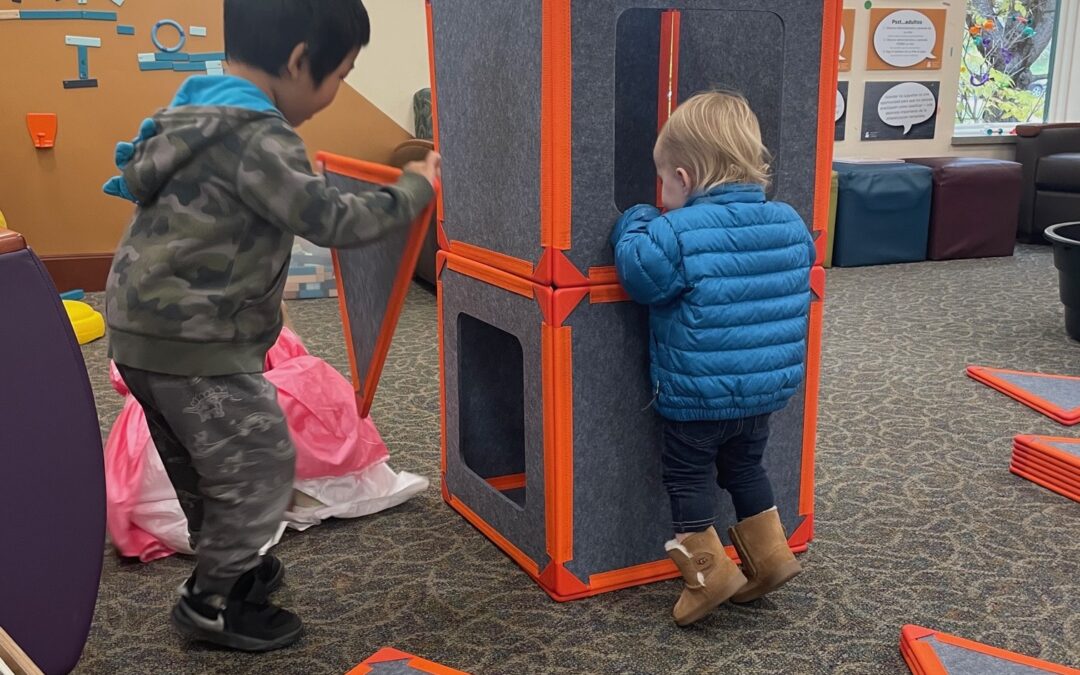 Kids playing with new materials at Alicia Ashman Library