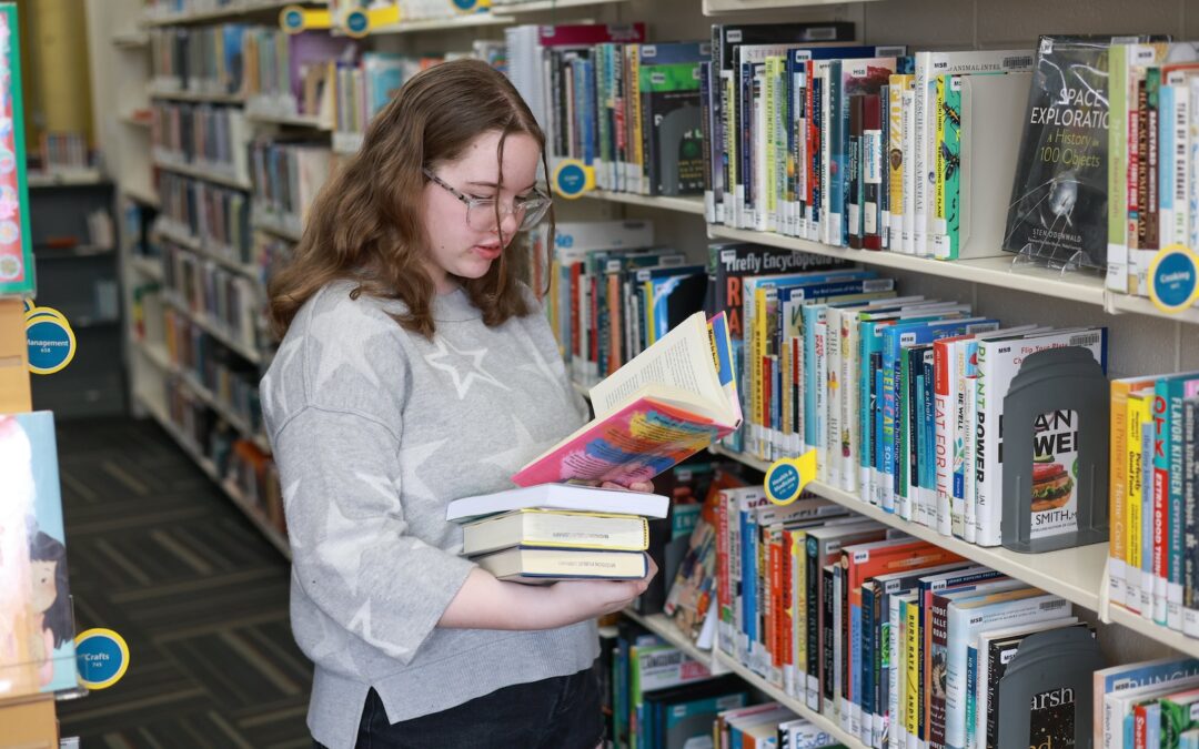 Teen girl browsing books