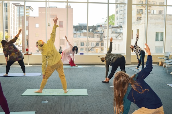 Library patrons doing yoga at Central Library event