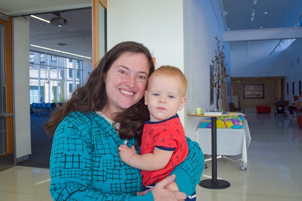 Mom holding infant at Central Library