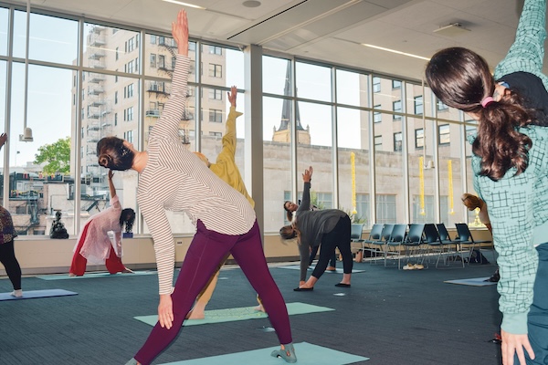 Patrons doing yoga during a Library Takeover event at Central Library in fall 2024