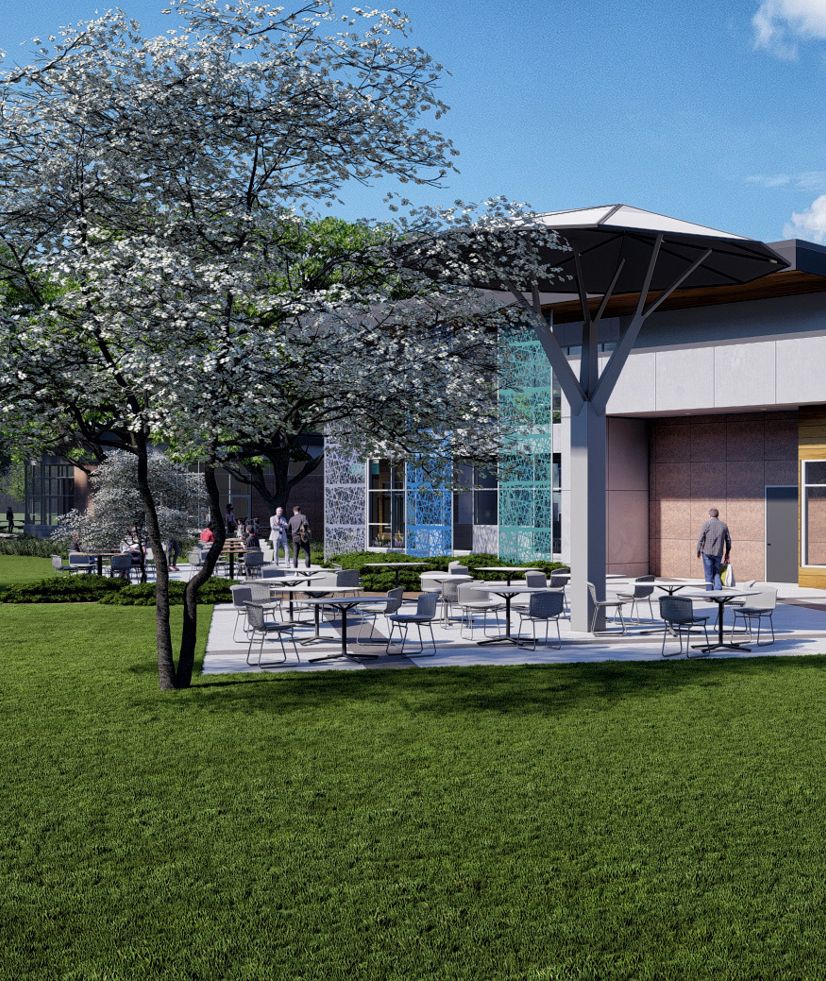 Rendering of patio with tables and chairs an modern building behind with large glass wall